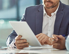 Man showing something on a tablet